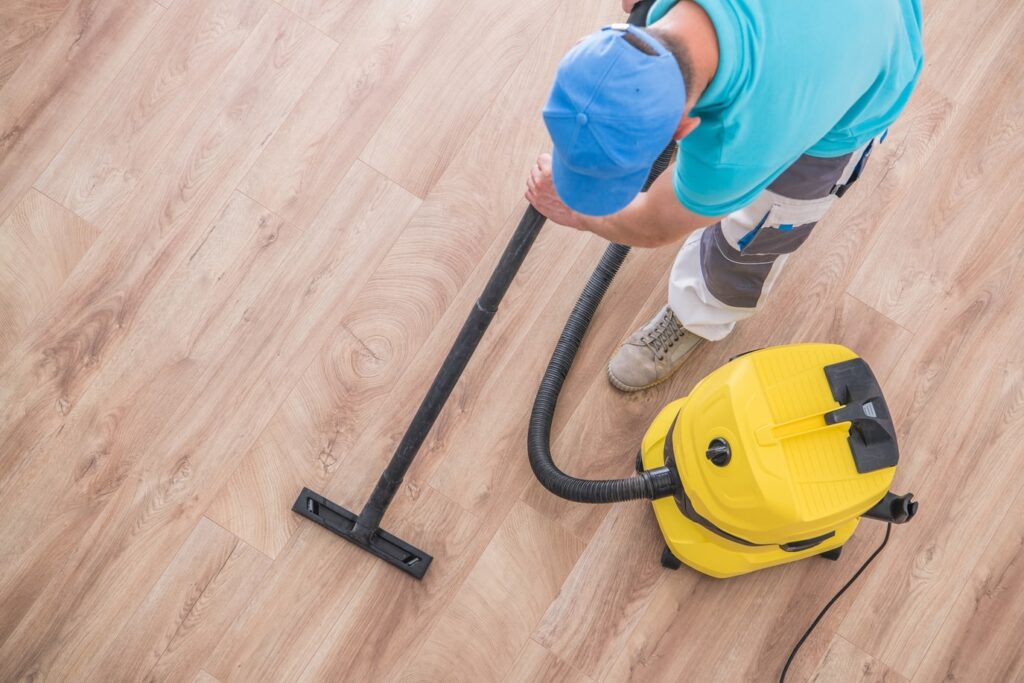 worker Maintaining Hardwood Floors